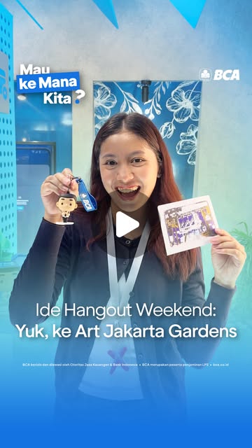 A visitor showing myBCA Space merchandise at Art Jakarta Gardens